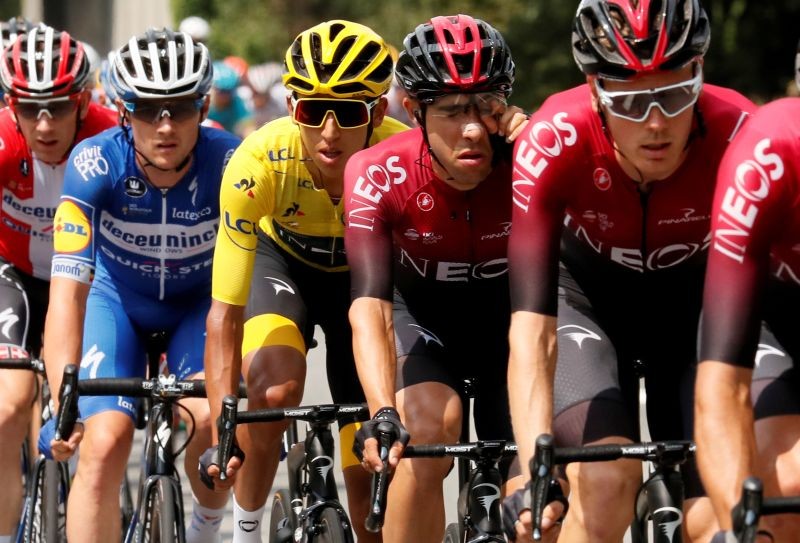 FILE PHOTO: Team INEOS rider Egan Bernal of Colombia, wearing the overall leader's yellow jersey, in the peloton. REUTERS/Gonzalo Fuentes/File Photo